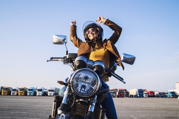 Happy female motocyclist