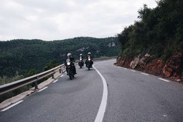 Group of motorcycle riders on mountain road